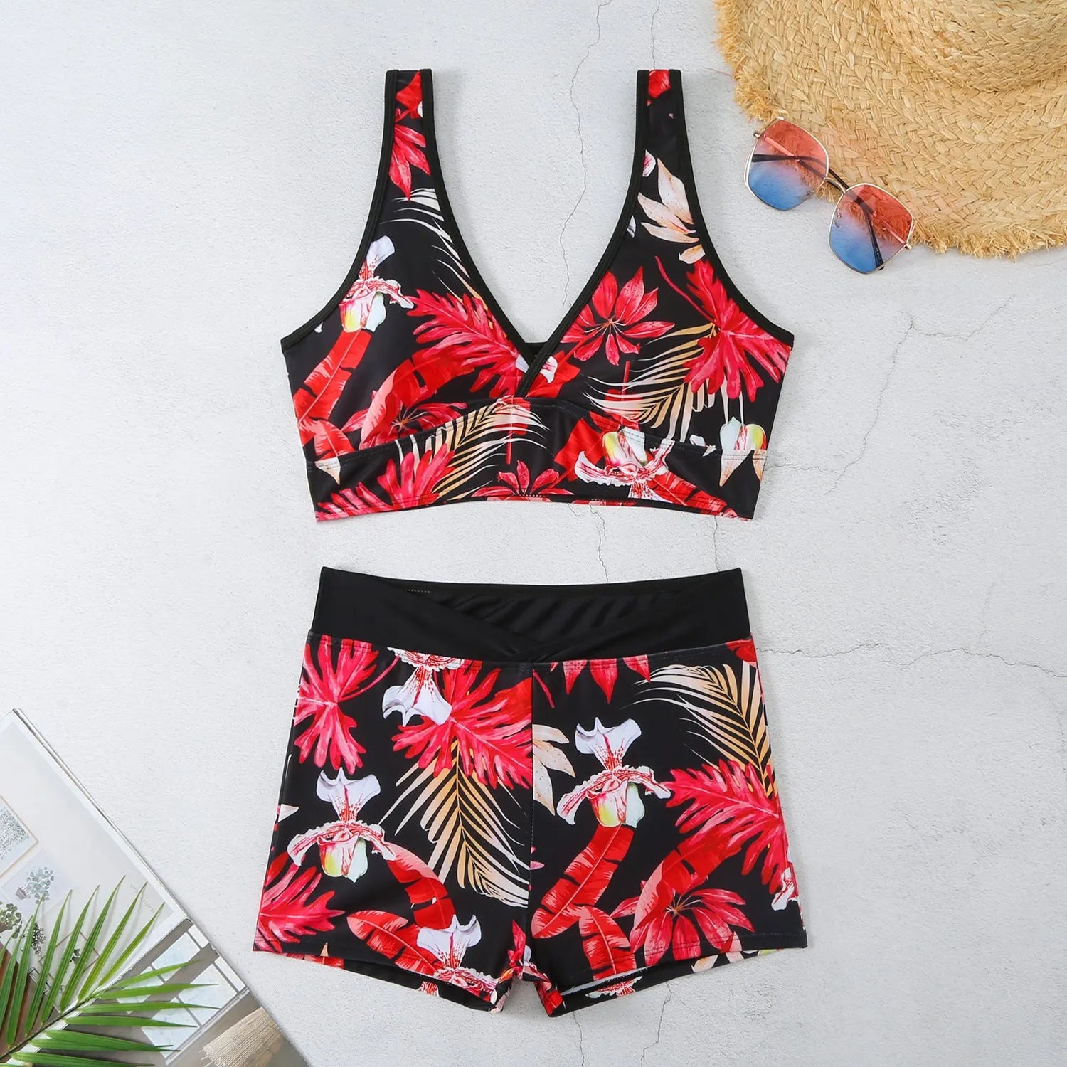 Women's two-piece swimsuit set with sleeveless top and printed boxer shorts in multiple colours.