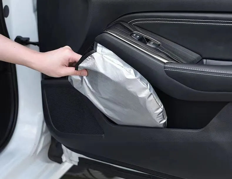 Aluminium foil car windscreen sunshade in silver, showing reflective surface.