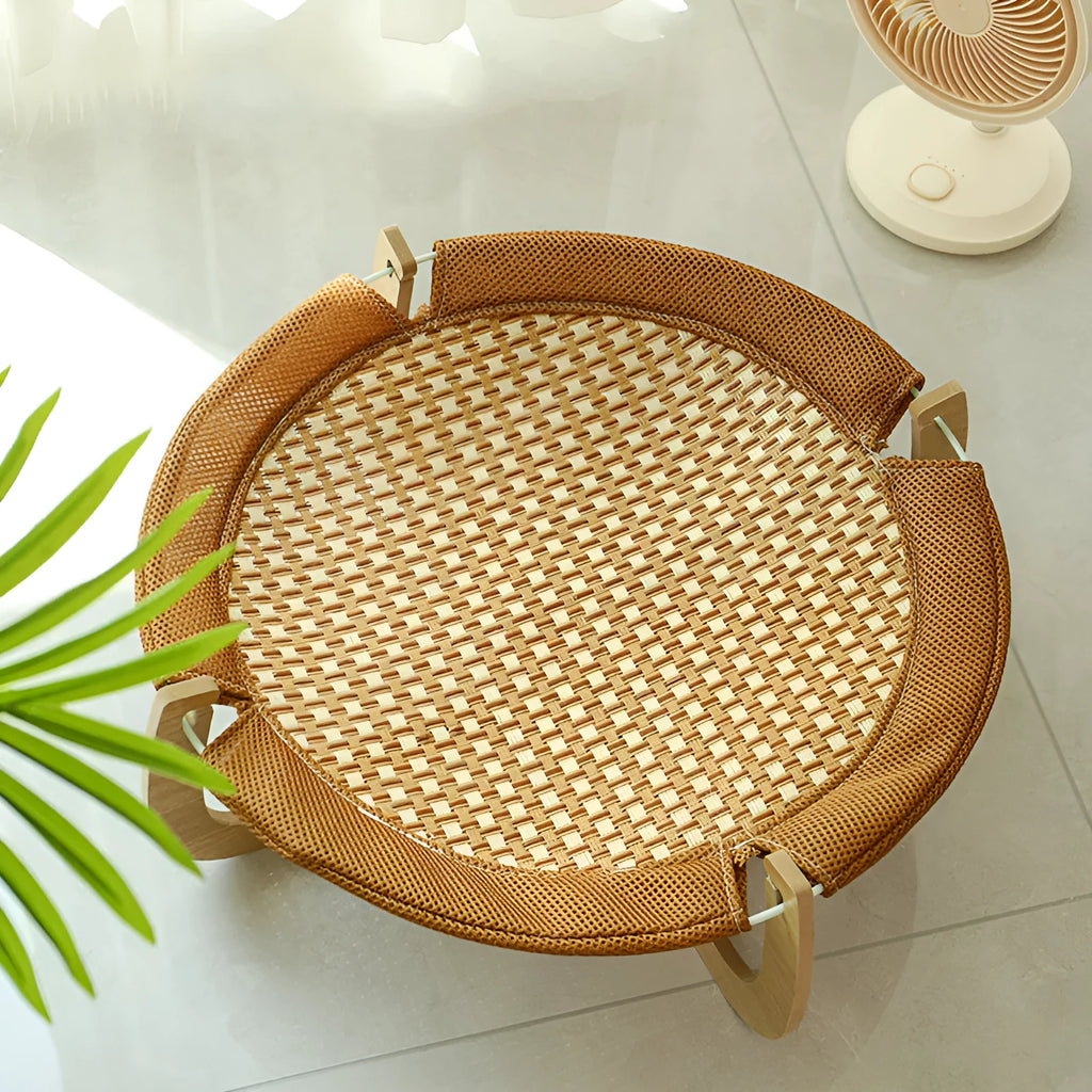 Brown woven rattan pet cooling bed hammock measuring 46cm square and 17.5cm high.
