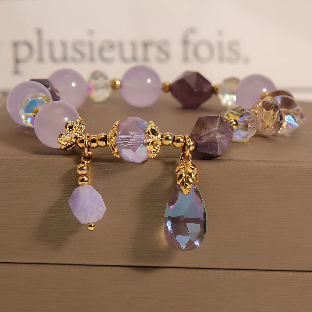 Lavender purple crystal water drop bracelet for children on display, retro original design