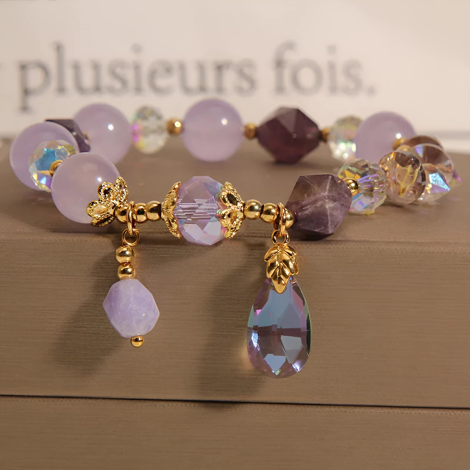 Lavender purple crystal water drop bracelet for children on display, retro original design
