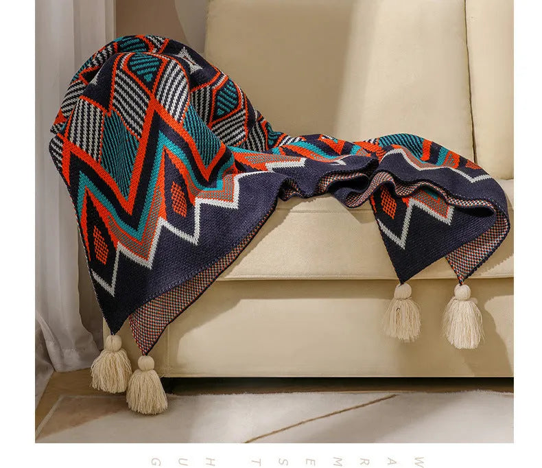 Bohemian style acrylic sofa throw blanket with tassel trim in a geometric pattern colour