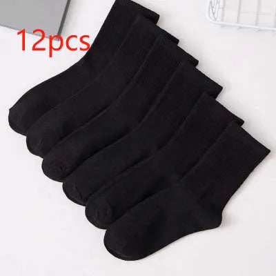 Black, white, and grey boat socks and medium tube socks from Degner in cotton blend fabric