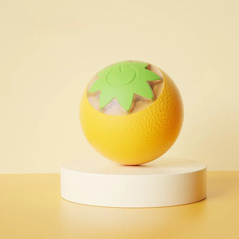 Automatic rolling ball toy for dogs and cats in green colour on floor