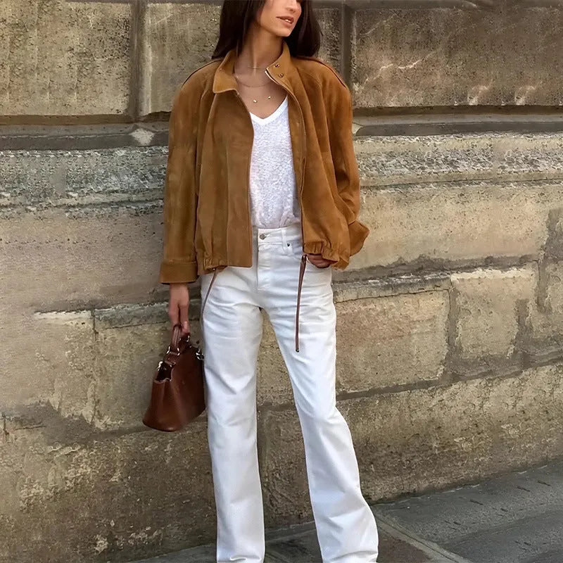 Loose fit solid colour retro jacket with long sleeves on a hanger.