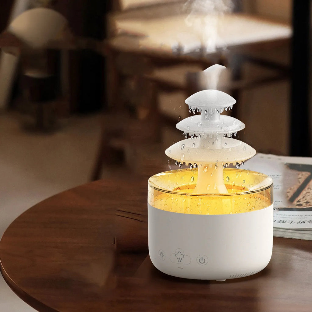 White plastic New Cloud Rain Air Humidifier with 500ml water tank and 7-colour atmosphere light on a wooden desk
