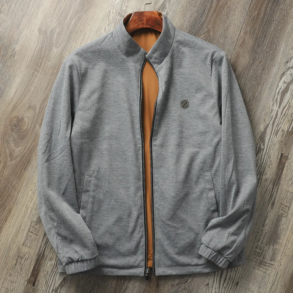 Men's stand collar casual jacket in blue, shown on a model.