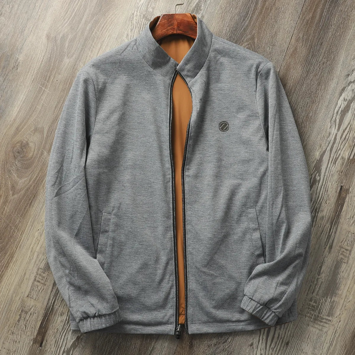 Men's stand collar casual jacket in blue, shown on a model.