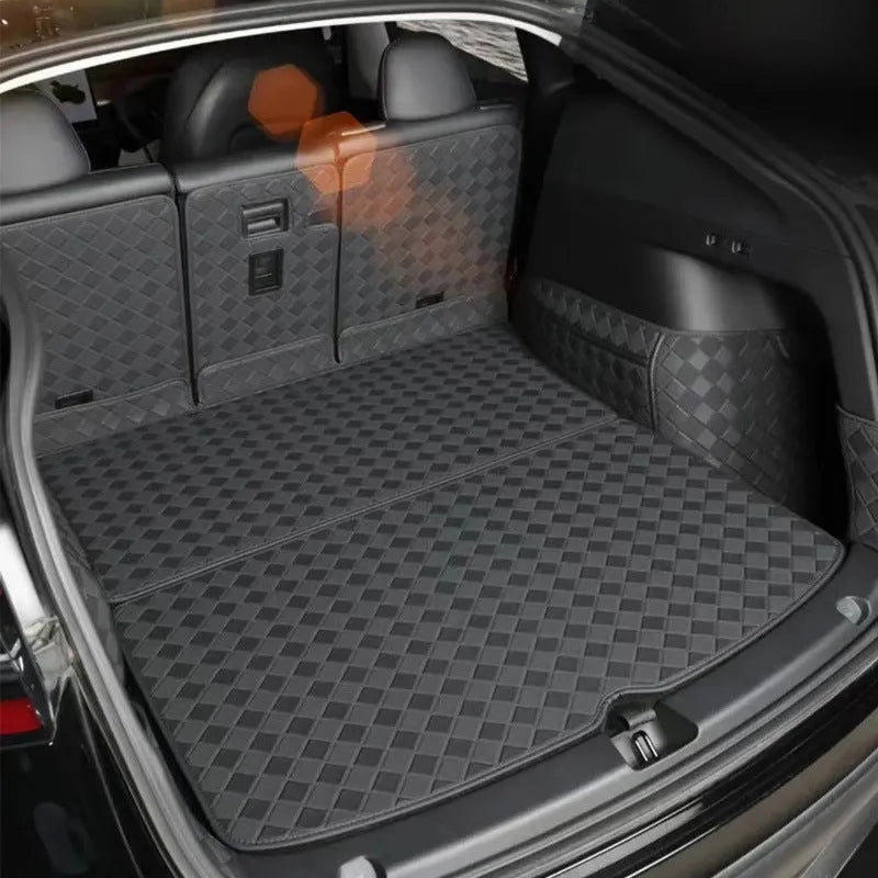 Leather trunk mat for Tesla Model 3 in black with buckle fitting lying in boot