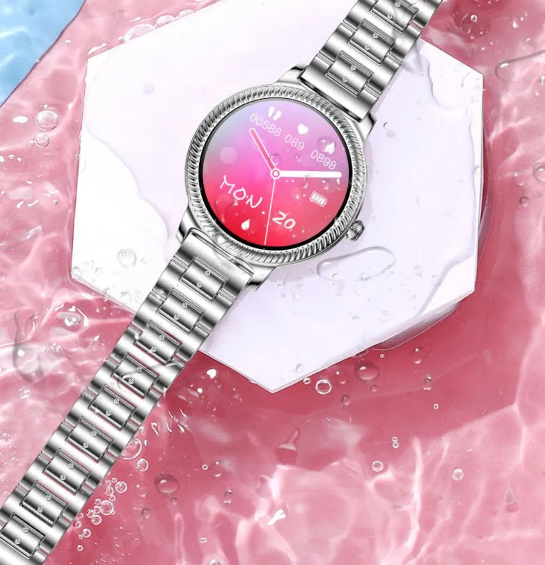AK38 Ladies Smart Watch with metallic stainless steel band on a wrist, showing its 1.09-inch colour screen.