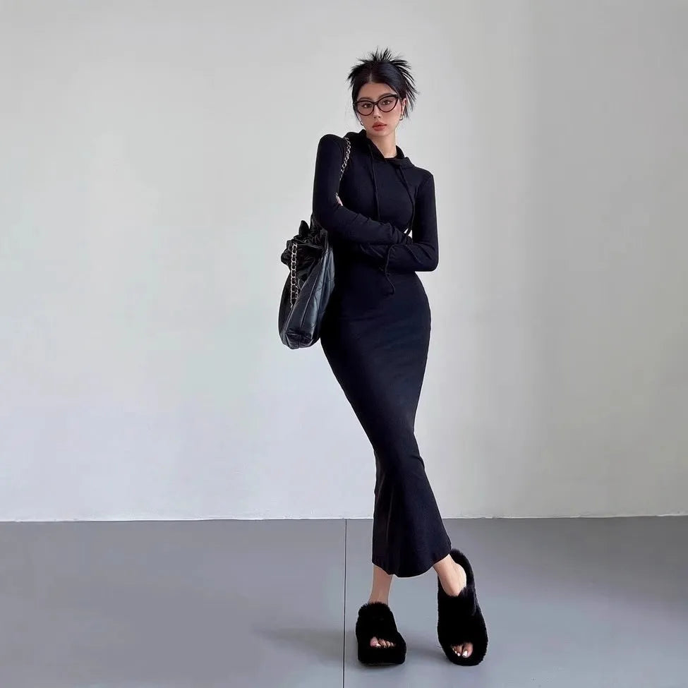 Women's grey hooded pullover dress with long sleeves and a high-waist sheath silhouette.
