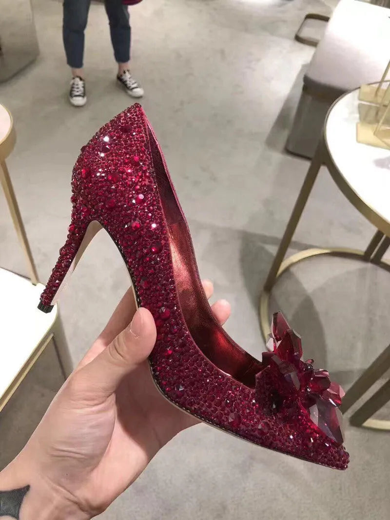 Women's gold pointed toe high heels with rhinestone and bow decoration on sequin cloth