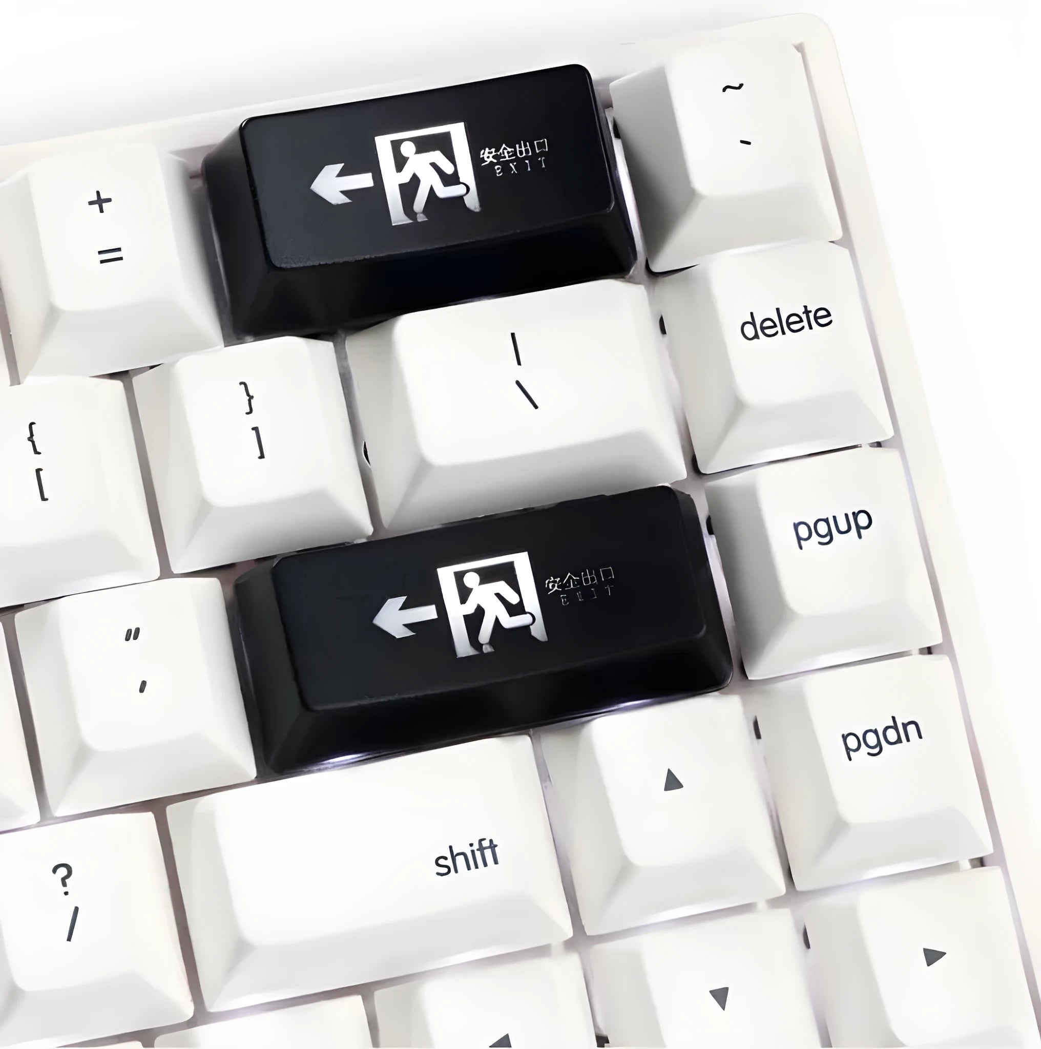 Red safety evacuation exit backspace key cap on a USB keyboard with transparent plastic construction