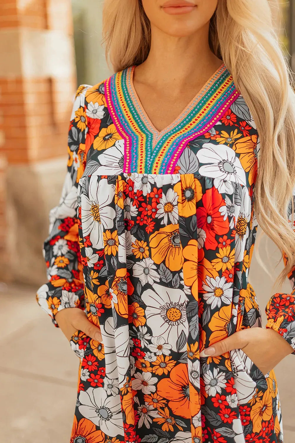 Orange floral print women's dress with striped lace sleeves and hem, V-neck long sleeve design.