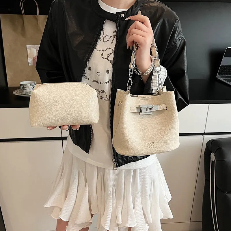 Soft PU retro bucket bag with chain detail on woman's shoulder