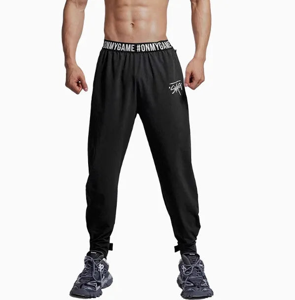 Loose cropped sports pants with printed waistband in grey, black, and blue colour options