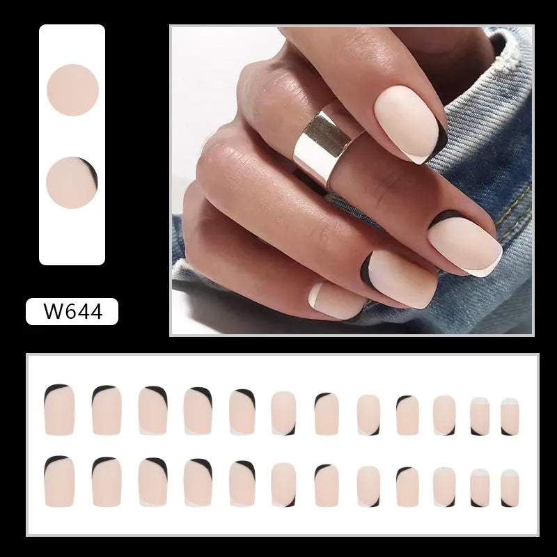 Black and white frosted French style false nails with mandarin duck colour contrast on plastic wearable armour.