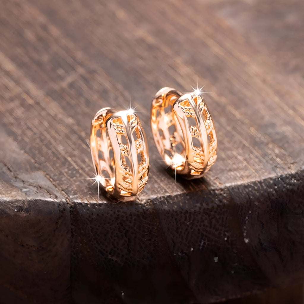 Rose gold plated copper leaf earrings with hollowed out design and heart-shaped detail