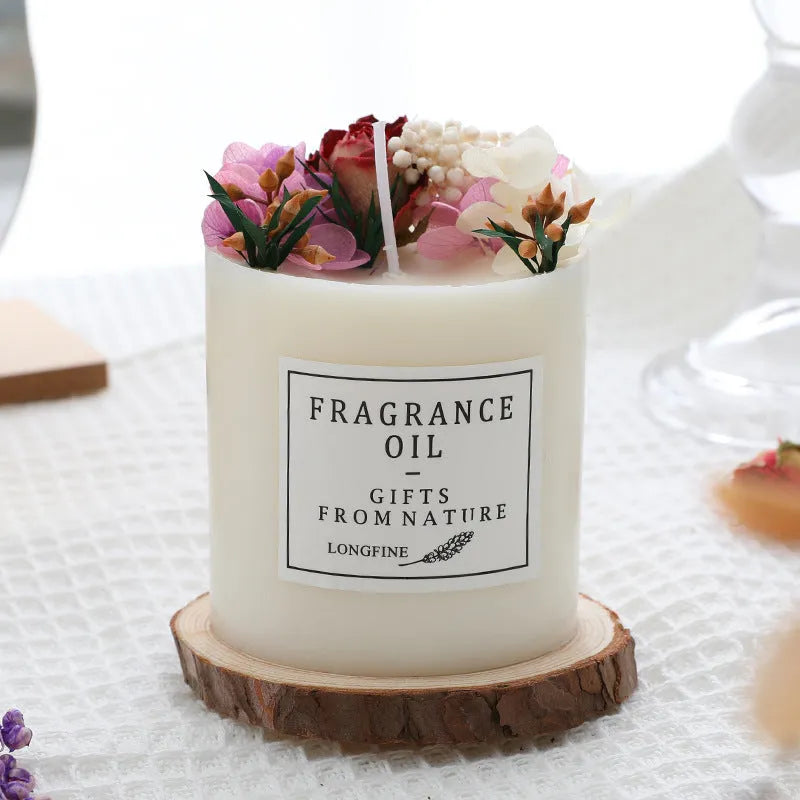 Aromatherapy candle with dried flowers on top, shown in various scent style options.