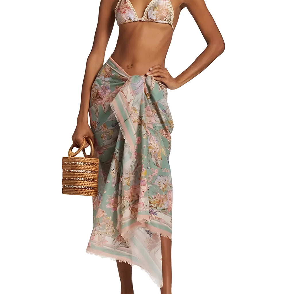Women's floral print bikini set with skirt in creamy-white beige, shown on a mannequin