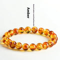 Natural yellow piebald amber bracelet with geometric beads and polished finish