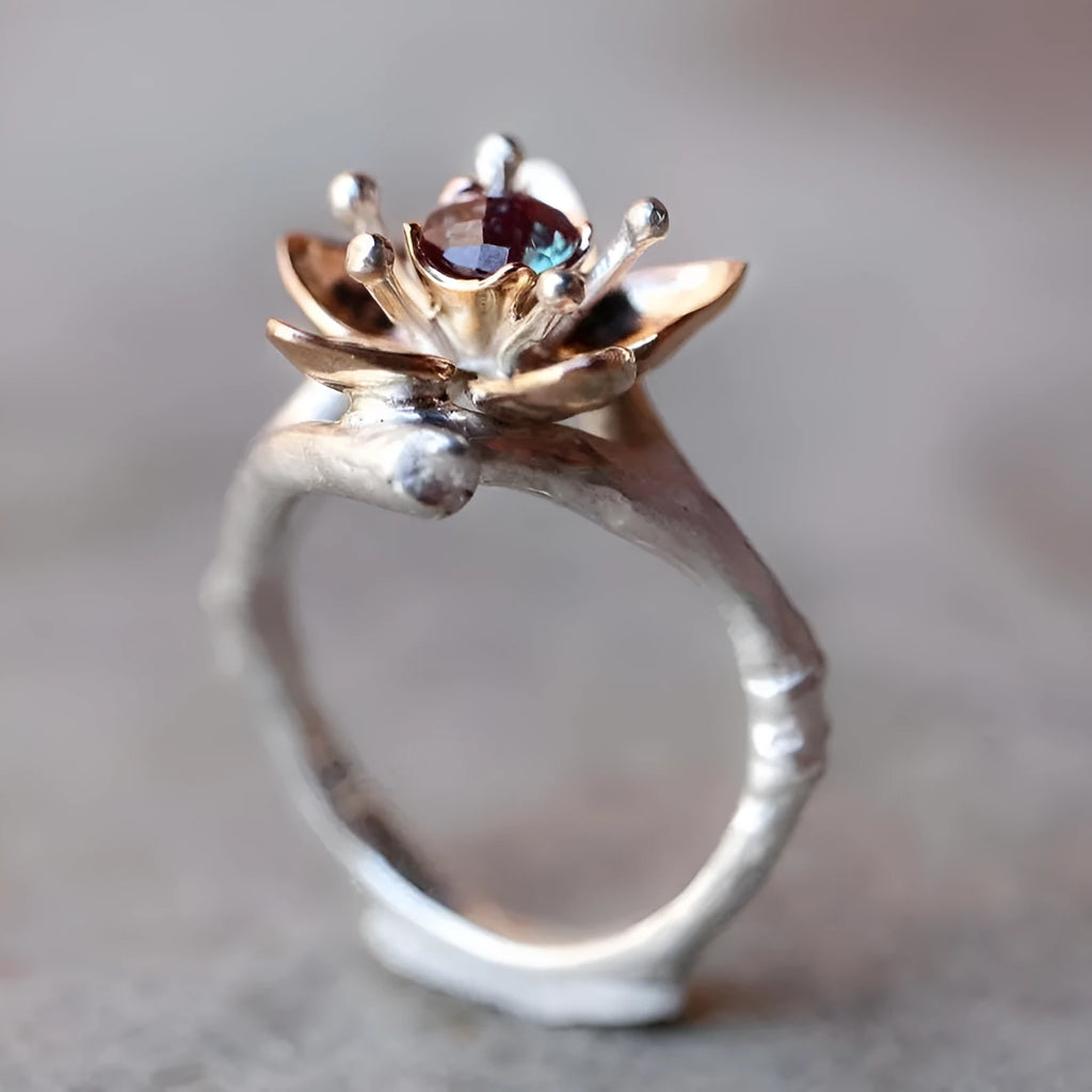 Silver tone women's ring with geometric floral design and two-tone finish