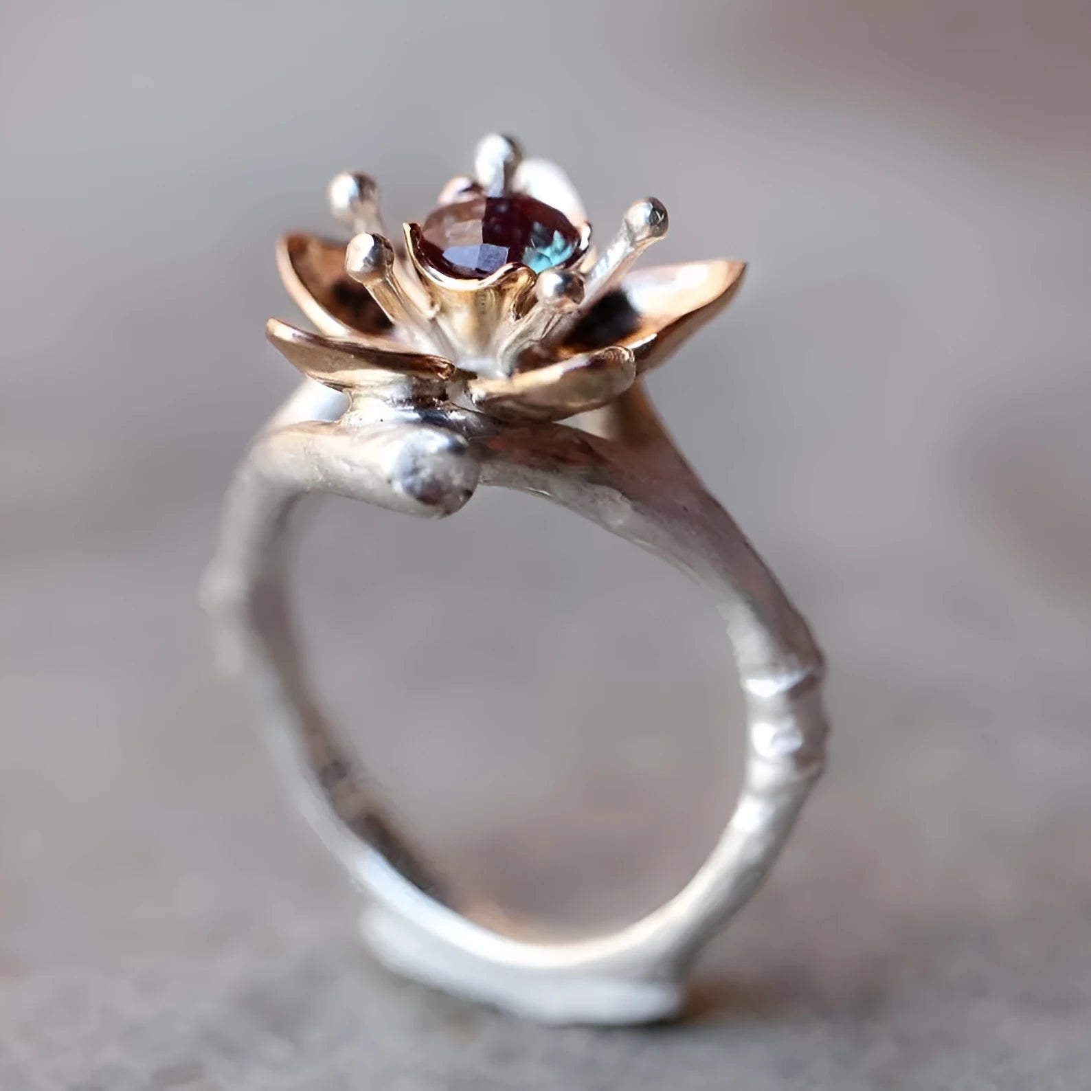 Silver tone women's ring with geometric floral design and two-tone finish