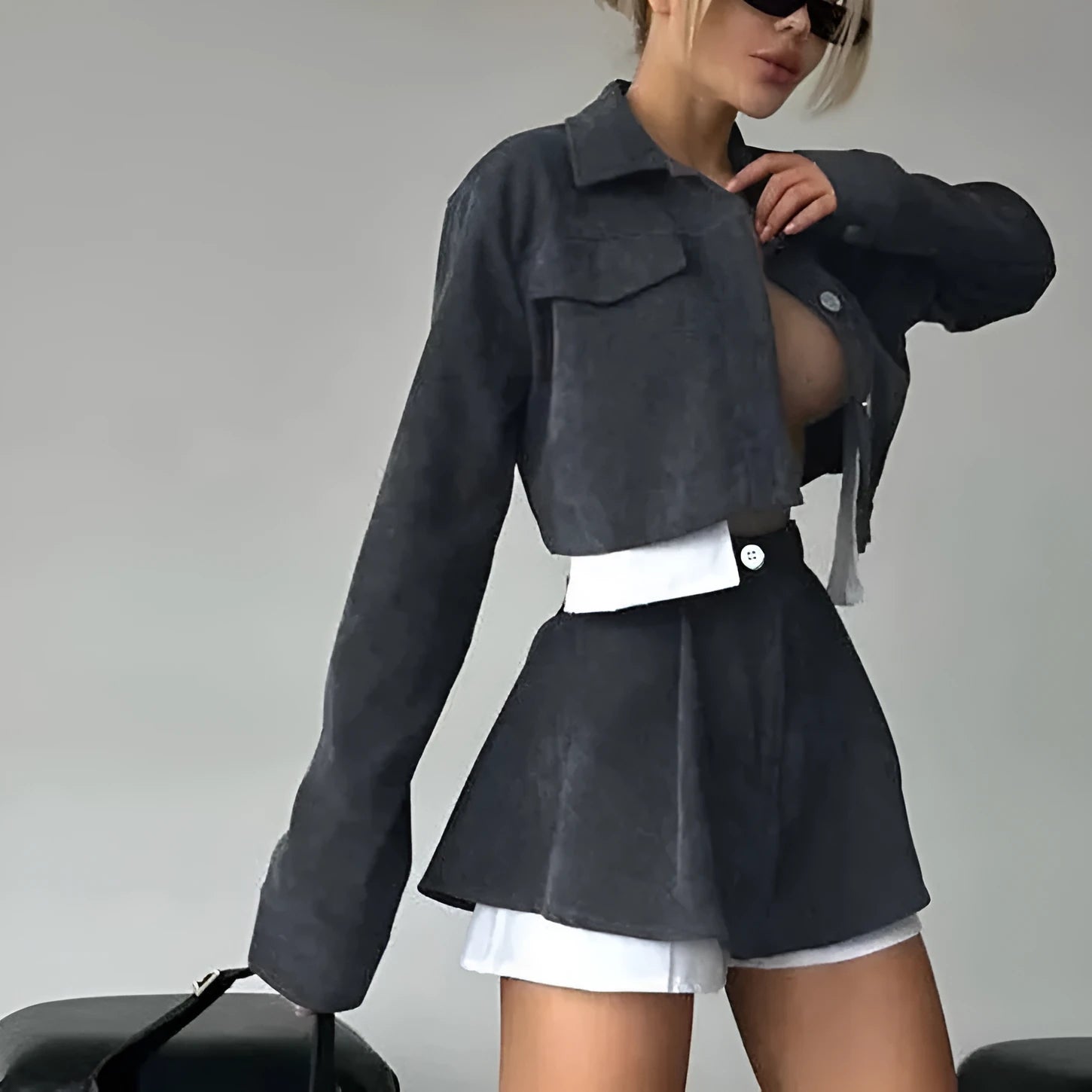 Women's two-piece set with long sleeve cardigan and cake short skirt in black, with blended fabric.