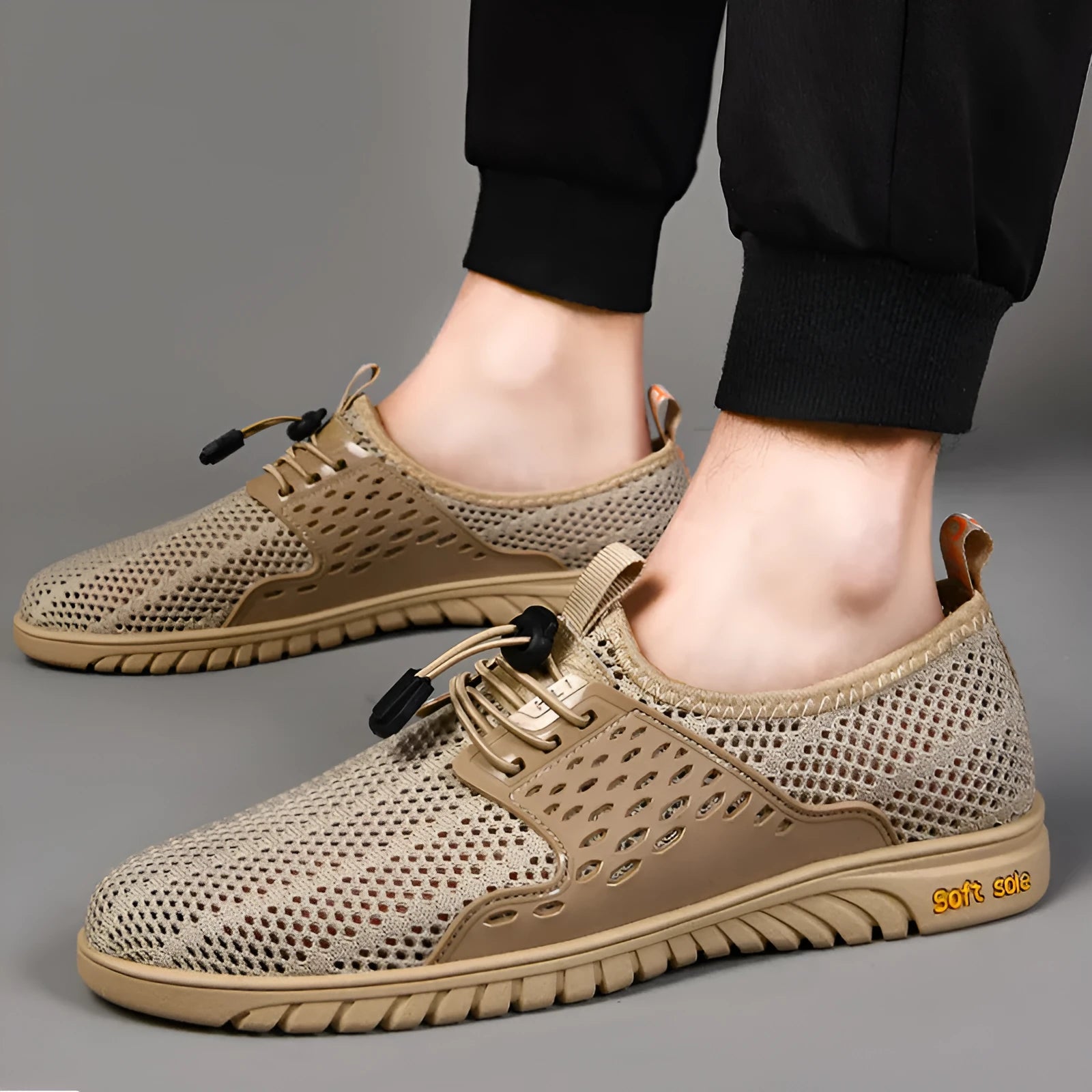 Men's casual mesh shoes with elastic band fastening in black, grey or sand colours