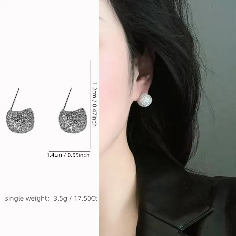 Women's geometric drop-shaped gold earrings with full diamond little golden beans design and spherical elements