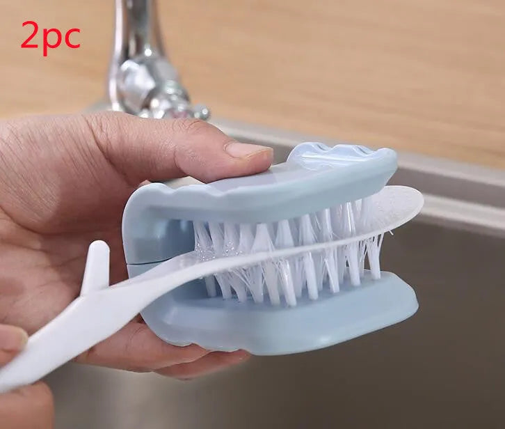 U-shaped knife and cutlery cleaner brush with ABS bristles in blue, resting on a kitchen counter
