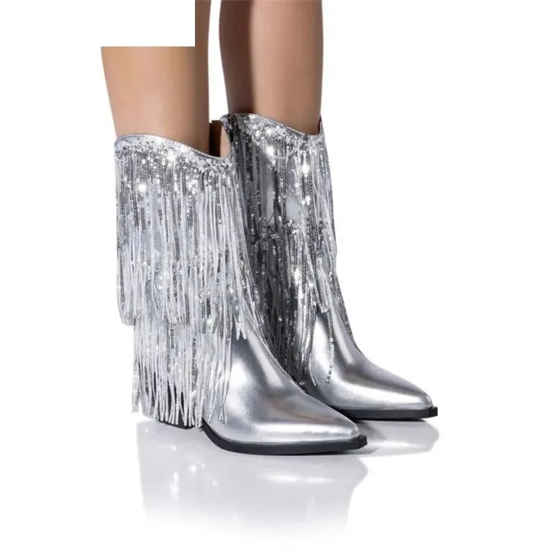 Women's black chunky heel tassel ankle boots with a pointed toe and super high stiletto heel.