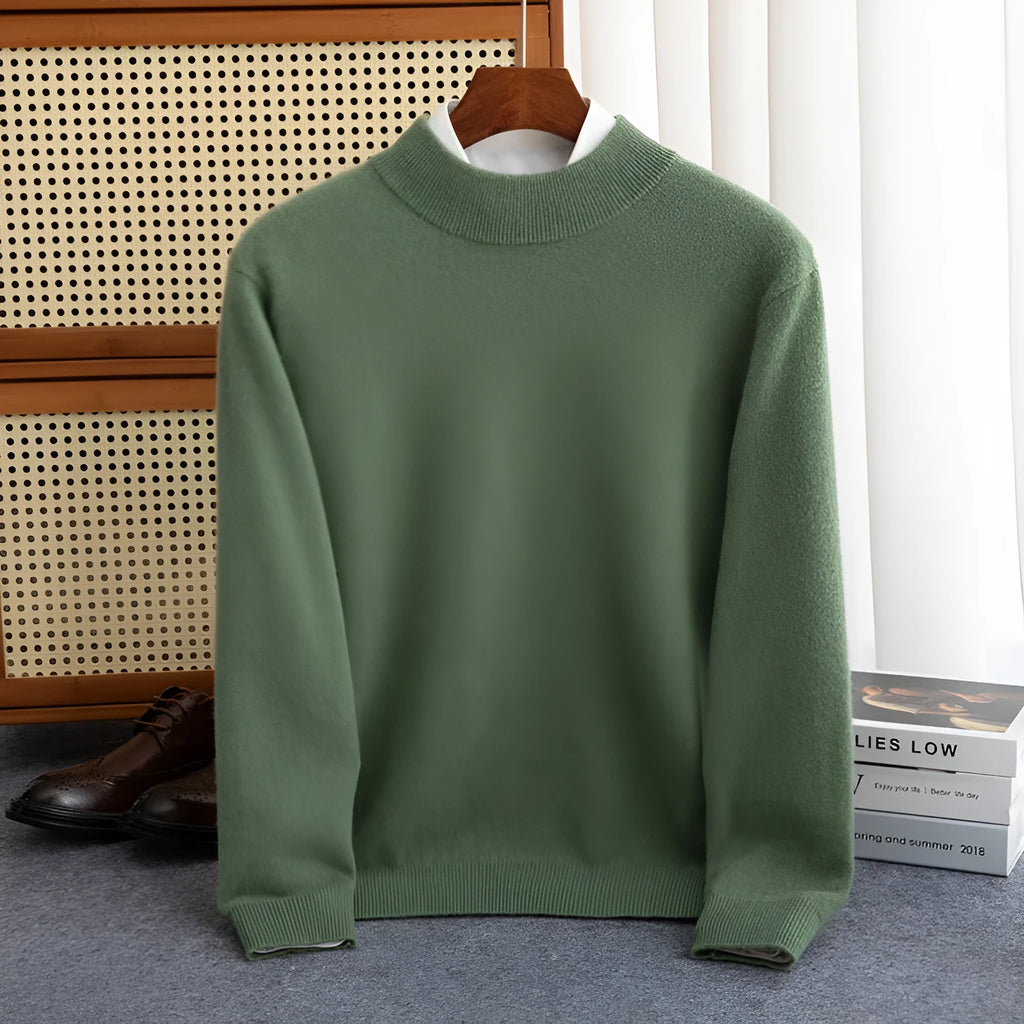 Man wearing a loose-fit half-turtleneck wool sweater in a neutral colour.