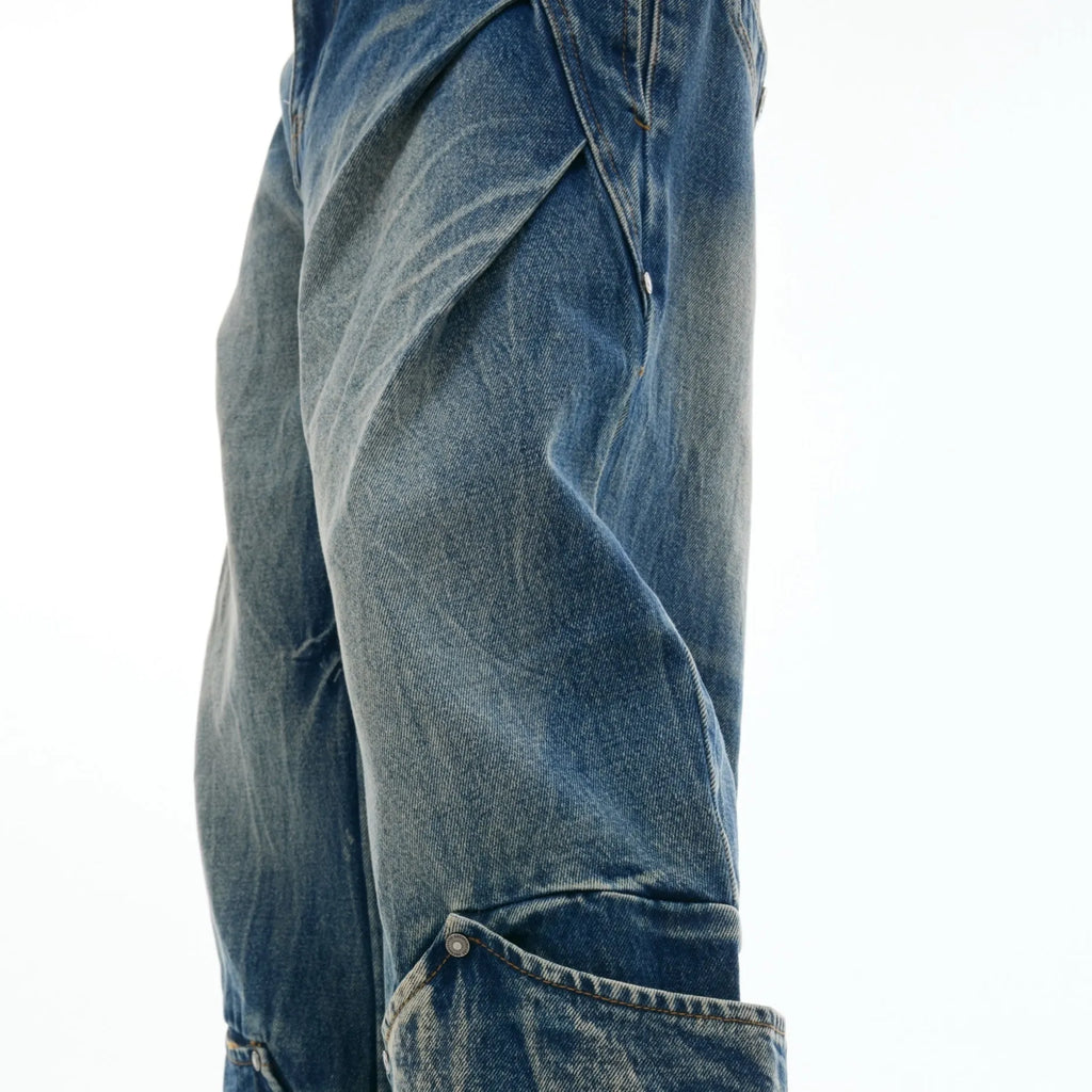 Men's verdant blue jeans with washed burst pattern and curved knife design detail