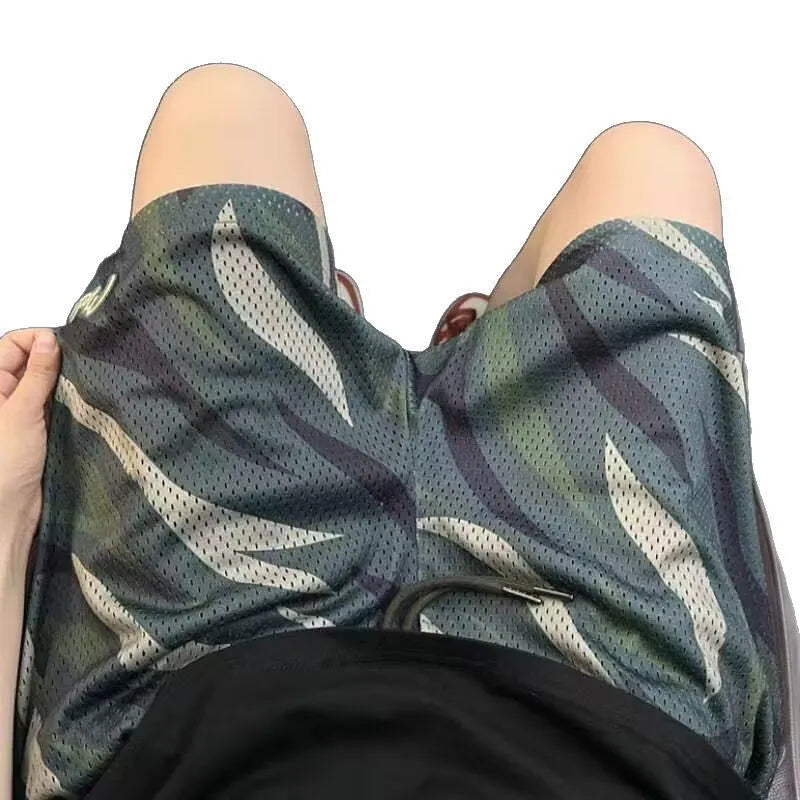 Men's straight-leg camouflage mesh shorts in cotton blend fabric showing size options