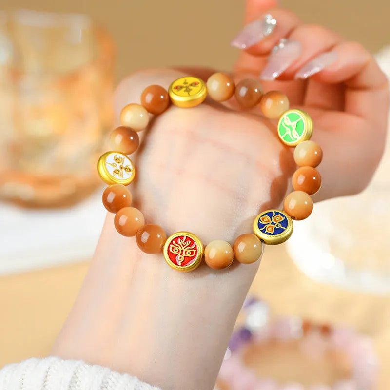 Handmade bodhi seed bracelet with yellow round beads in geometric five-directions design