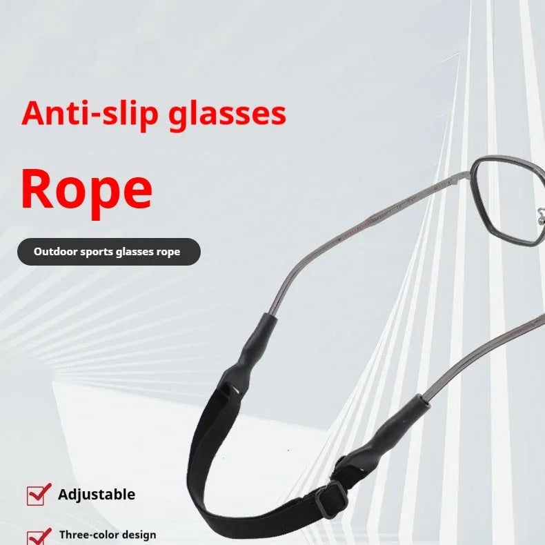 Black adjustable glasses cord with silicone end pieces shown on a pair of spectacles.