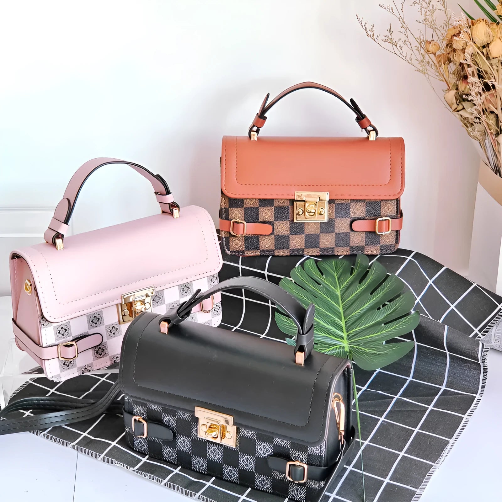Small square ethnic crossbody bag in apricot PU leather with stitching and plaid patterns.