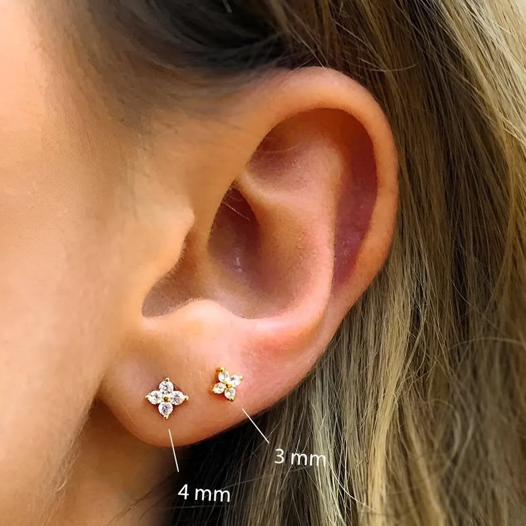 S925 sterling silver stud earrings with a crystal flower petal design in gold or platinum colour.
