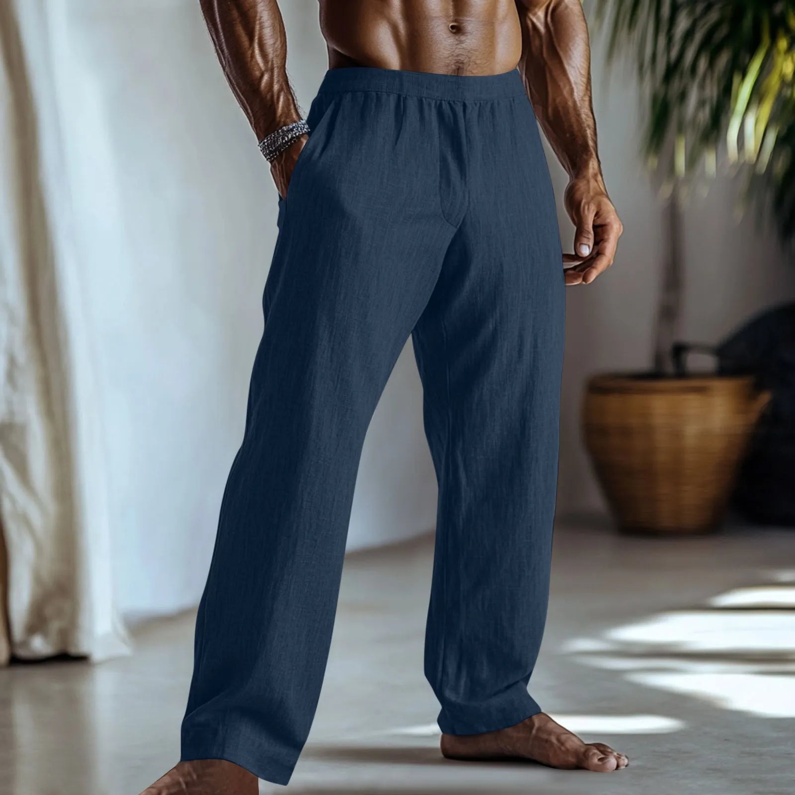 Straight-leg cotton linen trousers in light green colour with visible pockets and British style design.