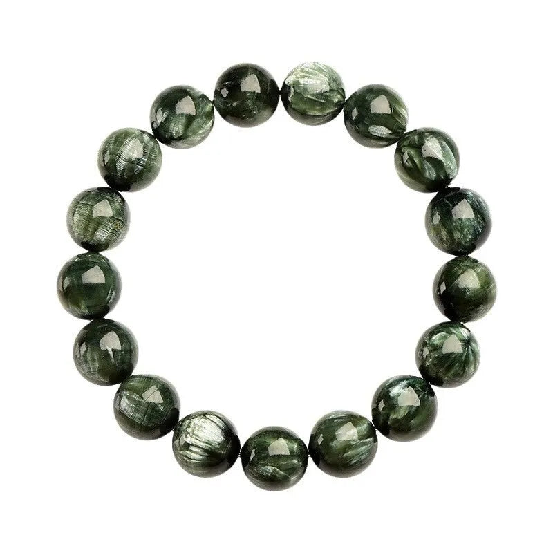 Natural green dragon crystal round bead bracelet with ruyi design on a wrist.