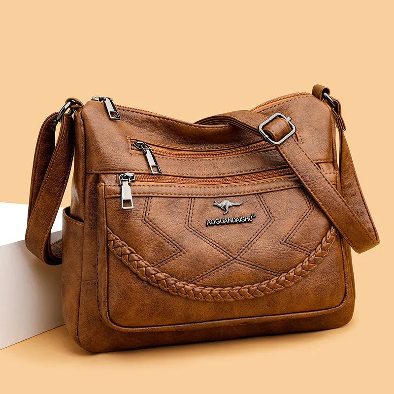 Soft leather large capacity shoulder bag in horizontal square shape with multiple compartments
