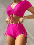 Lady's dark green lace-up bow swimsuit top with matching shorts on a mannequin.