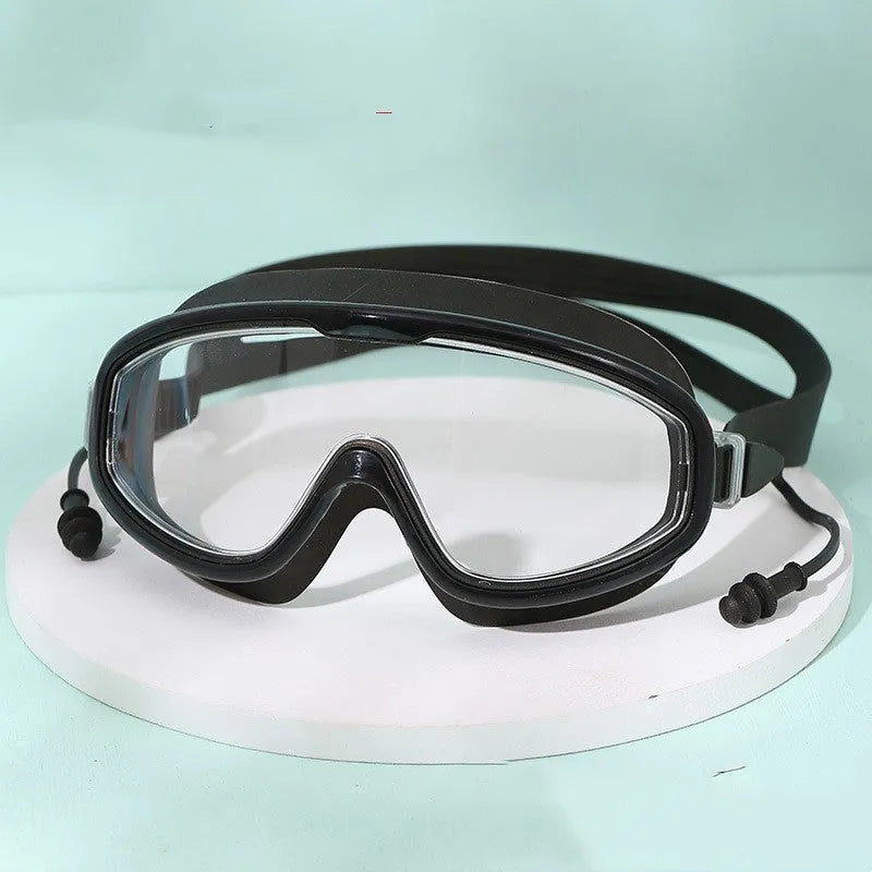 Large frame anti-fog swimming goggles in transparent blue for adults