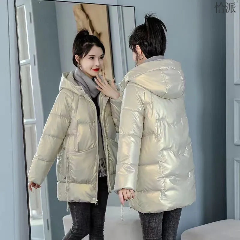 Women's loose fit thick hooded winter jacket in blue, shown on a model.