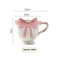 Ceramic mug with heart bow design in white powder or black pink colours, 301-400ml capacity