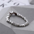 Women's handmade irregular silver square bracelet with wooden charm on elastic band