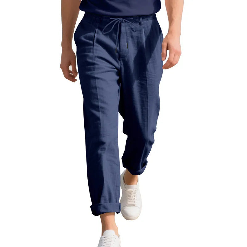Men's light grey linen casual trousers with a loose straight leg and drawstring waist