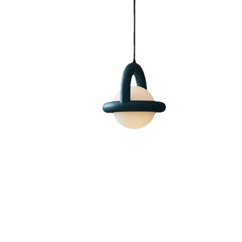 Modern Danish designer pendant lamp with adjustable cord in matte finish hanging above bedside