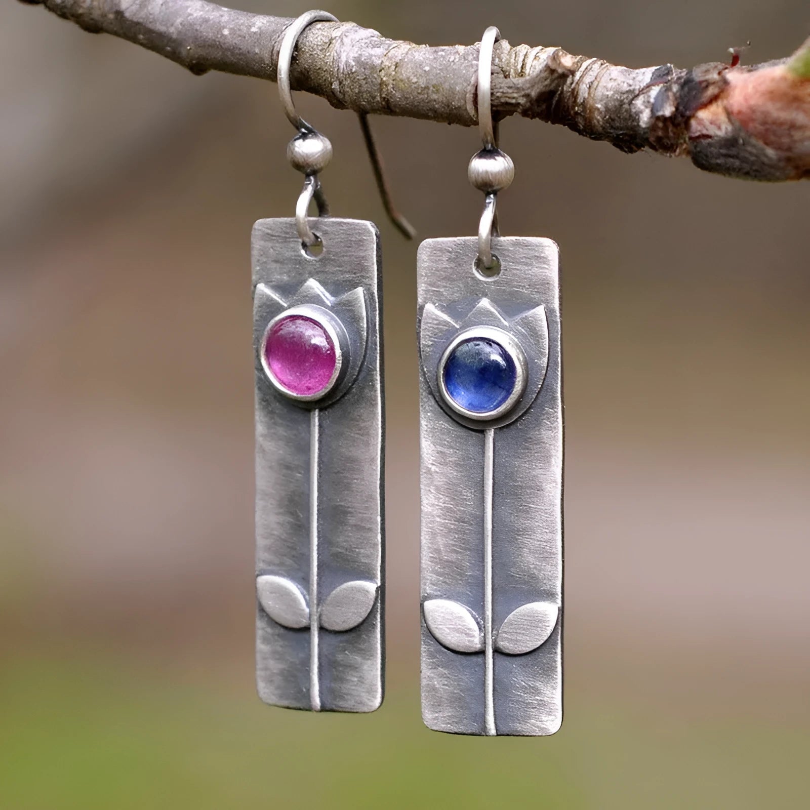 Antique finish red sapphire geometric earrings with ellipse shapes and electroplated metal construction
